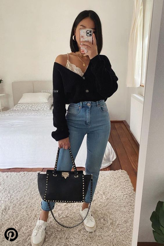 This classy black midi top paired with high waist fitted jeans and sneakers.