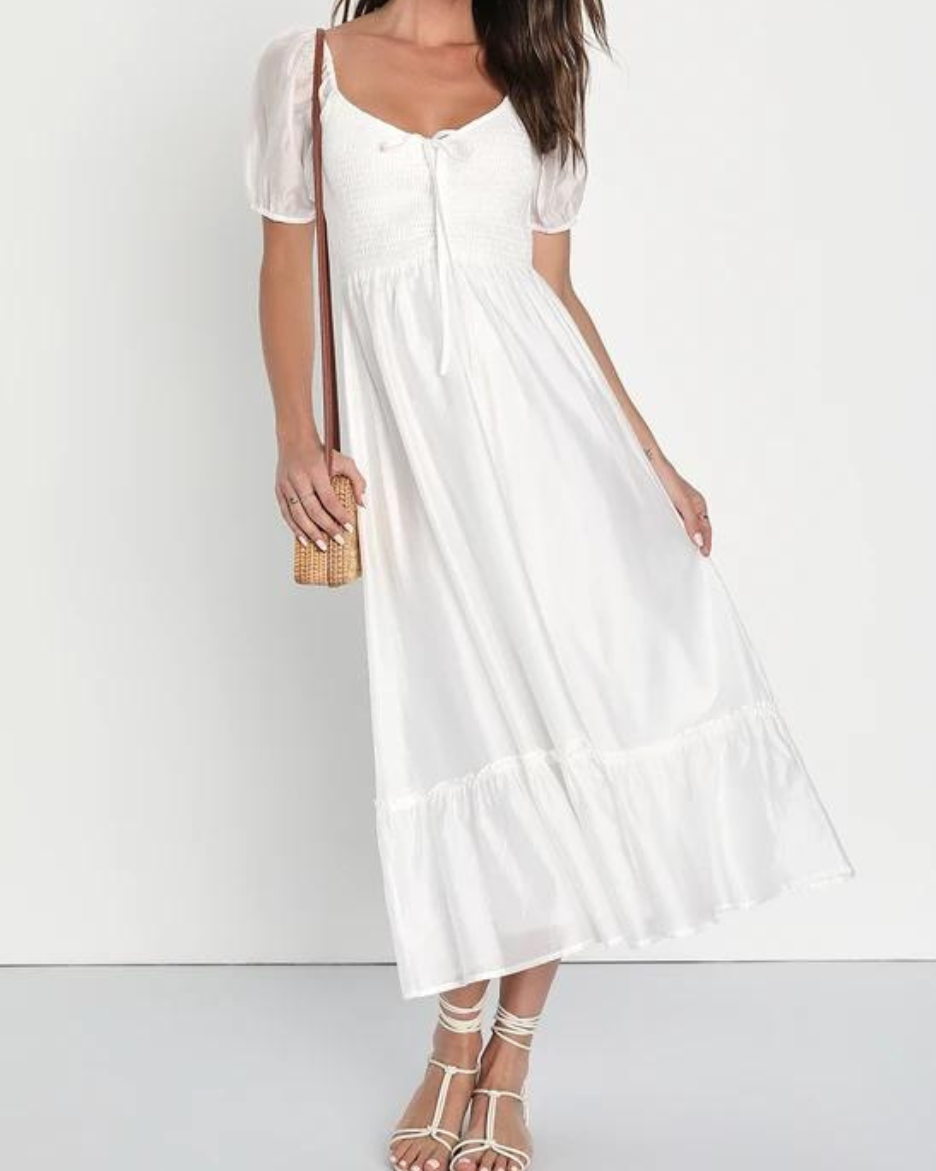  Cuppy in white midi dress.