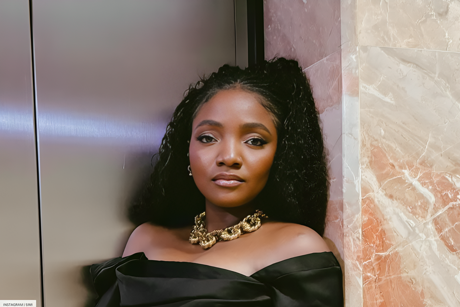 Simi Is All Black And Gold In Her Off-Shoulder Dress
