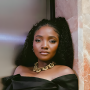 Simi Is All Black And Gold In Her Off-Shoulder Dress