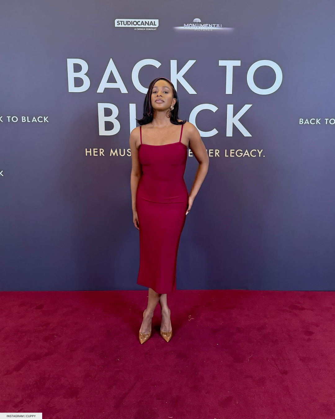 Cuppy slays in red dress at back to black premiere 
